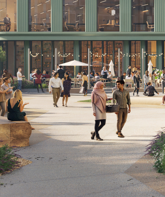 Habitat's large open plaza with inviting seating and lush greenery overlooked by creative office space